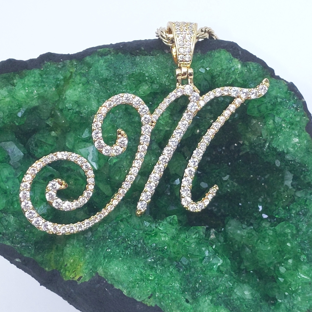 Initial M Pendant. No chain comes with it.